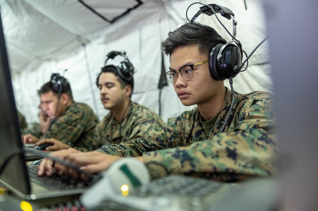 U.S. Marine Corps Cpl. Johnson Truong, an air support operations operator with Marine Air Support Squadron 3, Marine Air Control Group 38, 3rd Marine Aircraft Wing, coordinates fire missions from the Multifunction Air Operations Center in support of Exercise Steel Knight 23.2 at Marine Corps Base Camp Pendleton, California, Dec. 6, 2023. The MAOC provides expeditionary aviation command and control and air surveillance to the Marine Air-Ground Task Force. Steel Knight 23.2 is a three-phase exercise designed to train I Marine Expeditionary Force in the planning, deployment and command and control of a joint force against a peer or near-peer adversary combat force and enhance existing live-fire and maneuver capabilities of the MAGTF. (U.S. Marine Corps photo by Cpl. Daniel Childs)