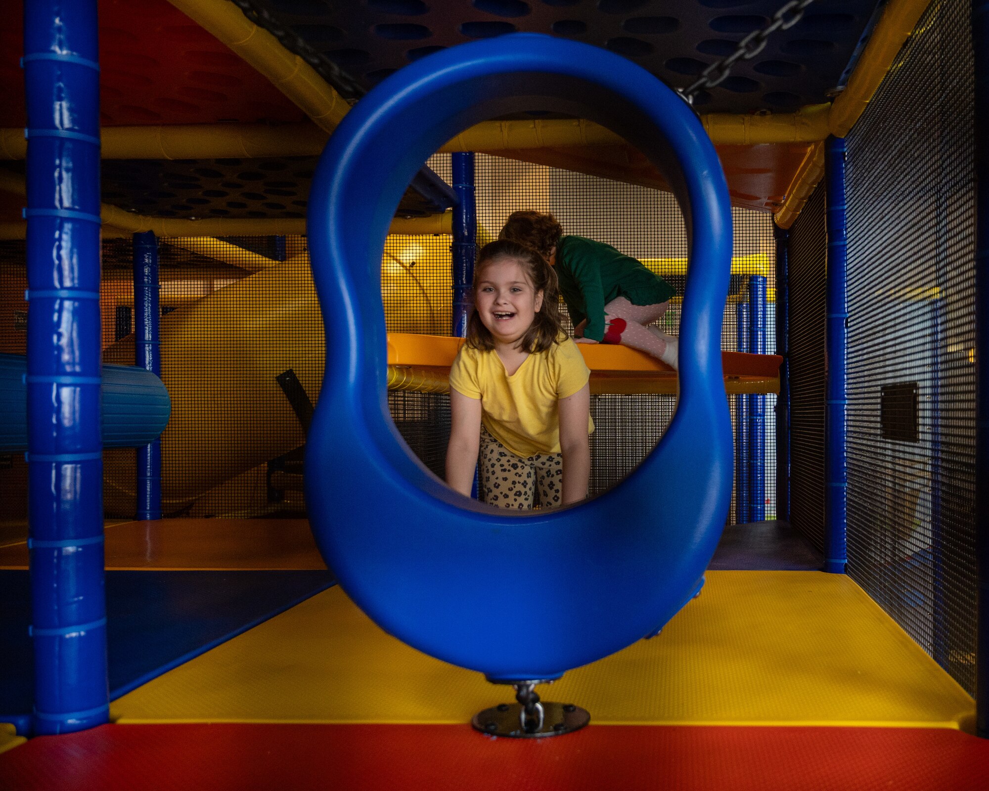 A child crawls through the second level of the large play area at the new indoor playground in the Losano Fitness Center at Laughlin Air Force Base, Texas, Jan. 20, 2024.