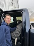 Coast Guardsmen posed for a photo after rescuing the dog.