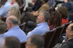 members in the audience smiling