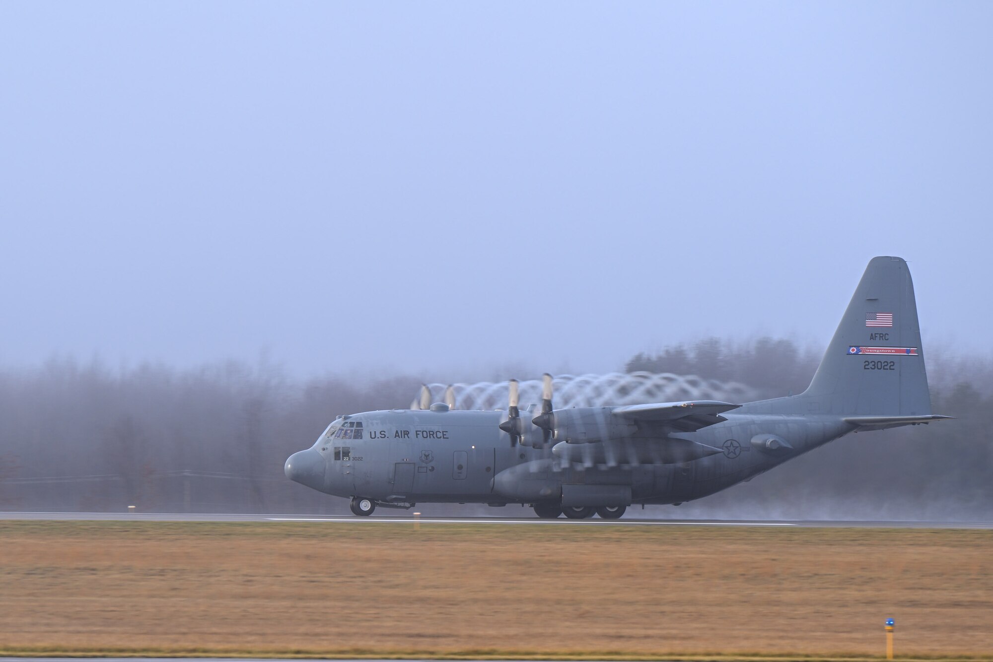 A C-130H Hercules aircraft assigned to the 910th Airlift Wing takes off as the fog lifts at Youngstown Air Reserve Station, Ohio, Jan. 25, 2024.