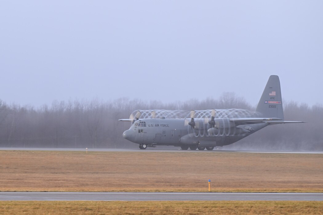 A C-130H Hercules aircraft assigned to the 910th Airlift Wing takes off as the fog lifts at Youngstown Air Reserve Station, Ohio, Jan. 25, 2024.