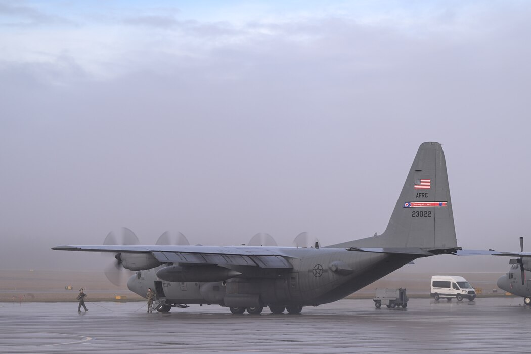 A C-130H Hercules aircraft assigned to the 910th Airlift Wing starts its engines on the aircraft ramp as the fog lifts at Youngstown Air Reserve Station, Ohio, Jan. 25, 2024.