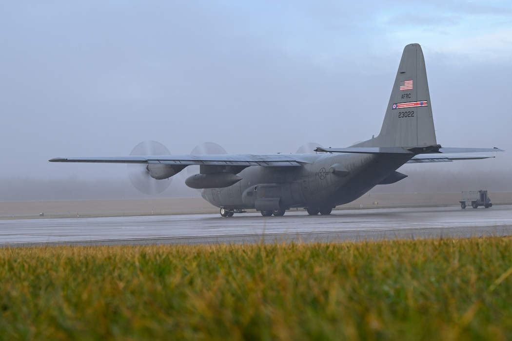 A C-130H Hercules aircraft assigned to the 910th Airlift Wing starts taxiing to the runway as the fog lifts at Youngstown Air Reserve Station, Ohio, Jan. 25, 2024.