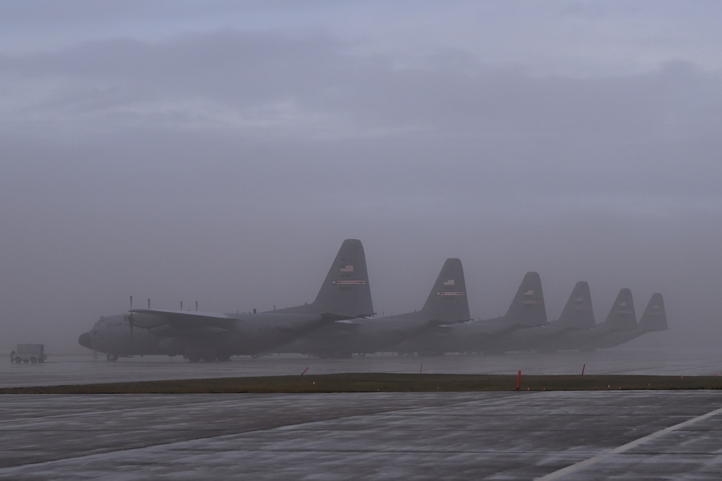 C-130H Hercules aircraft assigned to the 910th Airlift Wing sit on the aircraft ramp as the fog lifts at Youngstown Air Reserve Station, Ohio, Jan. 25, 2024.