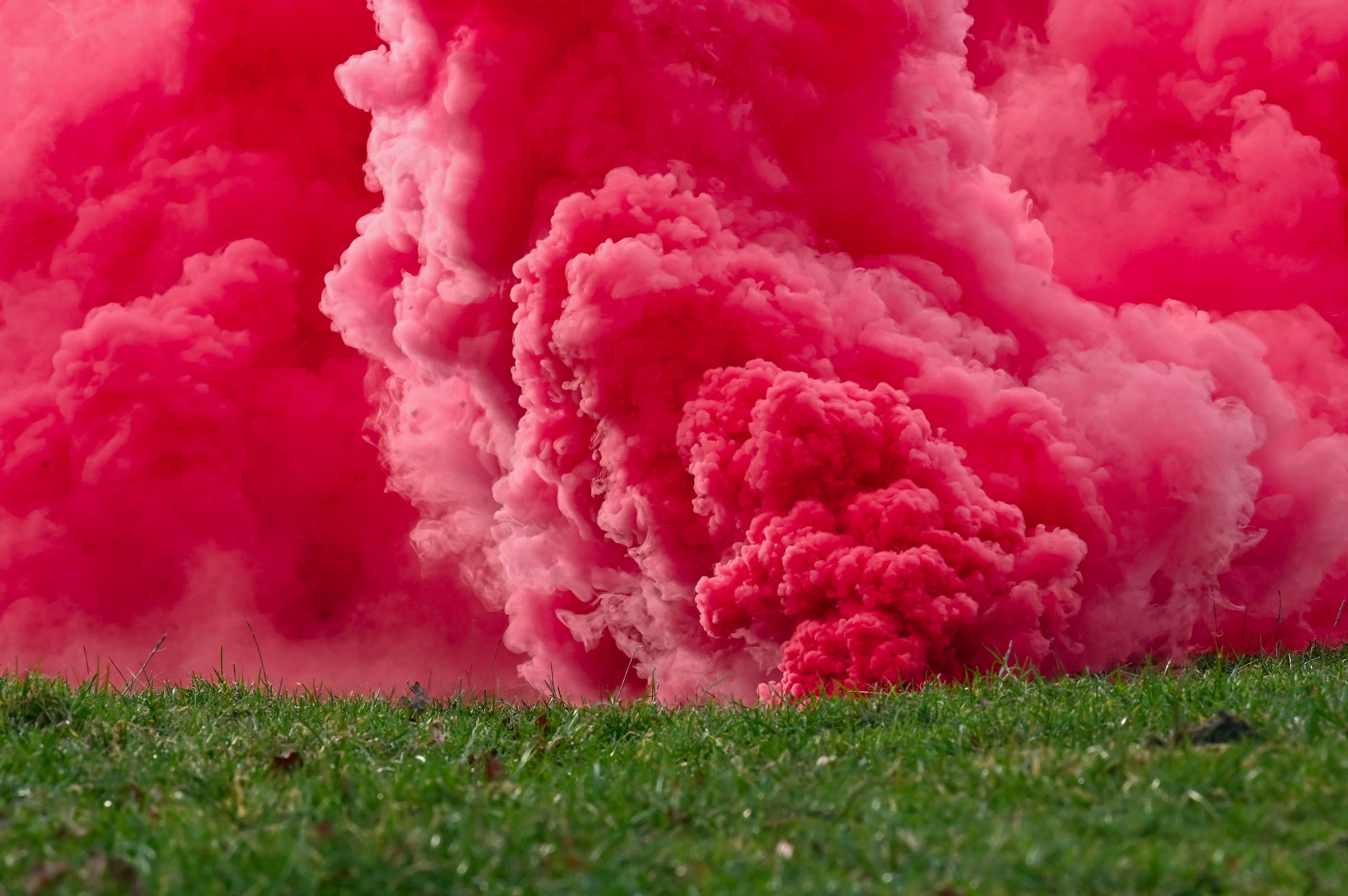 U.S. Airmen assigned to the 352nd Special Operations Wing released smoke grenades to practice signalling survival, evasion, resistance and escape instructors in case of emergencies during combat survival training.