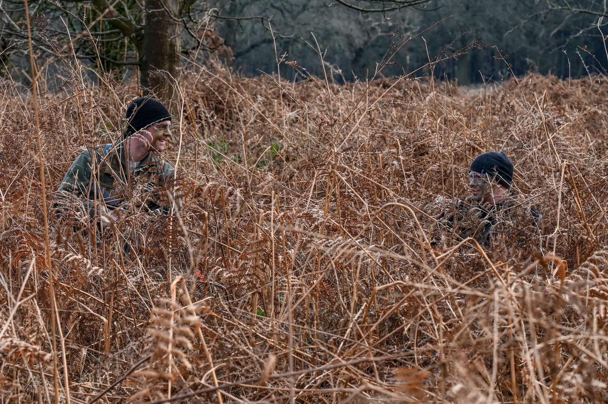 RAF Lakenheath Airmen applied camouflage face paint techniques to help conceal their location as they practiced evasion movements to avoid capture from potential adversaries.