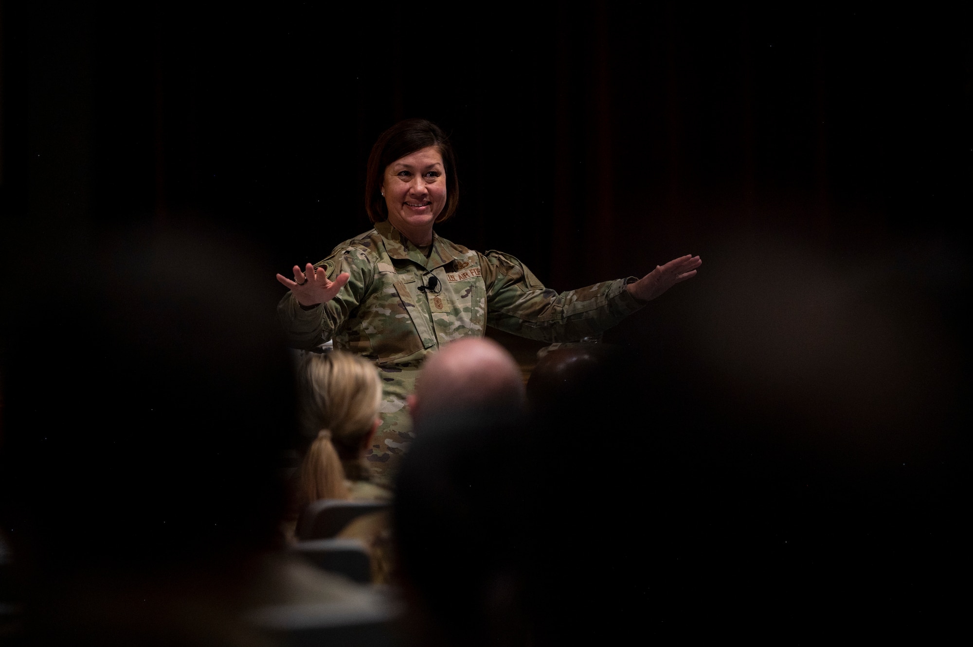 A woman speaks to a crowd.