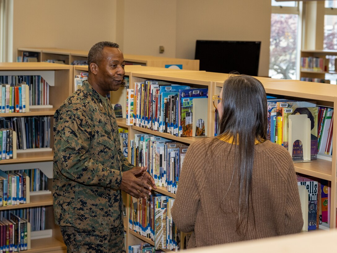 U.S. Marine Corps Col. Michael L. Brooks, the commanding officer of Marine Corps Base Quantico, speaks to Katelyn McManus, a library technician, during the Quantico Base Library grand re-opening at the General Alfred M. Gray Marine Corps Research Center on MCB Quantico, Virginia, Jan. 24, 2024. The library was closed for a three-month period of renovations that redesigned the library layout to be more inviting for service members and their families. (U.S. Marine Corps Photo by Lance Cpl. Kayla LeClaire)