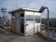 Downstream control stand to be removed and replaced with a 2-story structure.