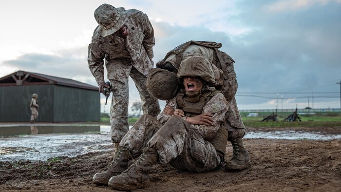 U.S Marine Corps Sgt. Taliban Wesley, a drill instructor with Echo Company, 2nd Recruit Training Battalion, gives commands to recruits during the Crucible  at Marine Corps Base Camp Pendleton, California, Jan. 23, 2024. The Crucible is a 54-hour exercise where recruits apply the knowledge and training they’ve learned throughout recruit training to earn the title of United States Marine. (U.S. Marine Corps photo by Lance Cpl. Sarah M. Grawcock)