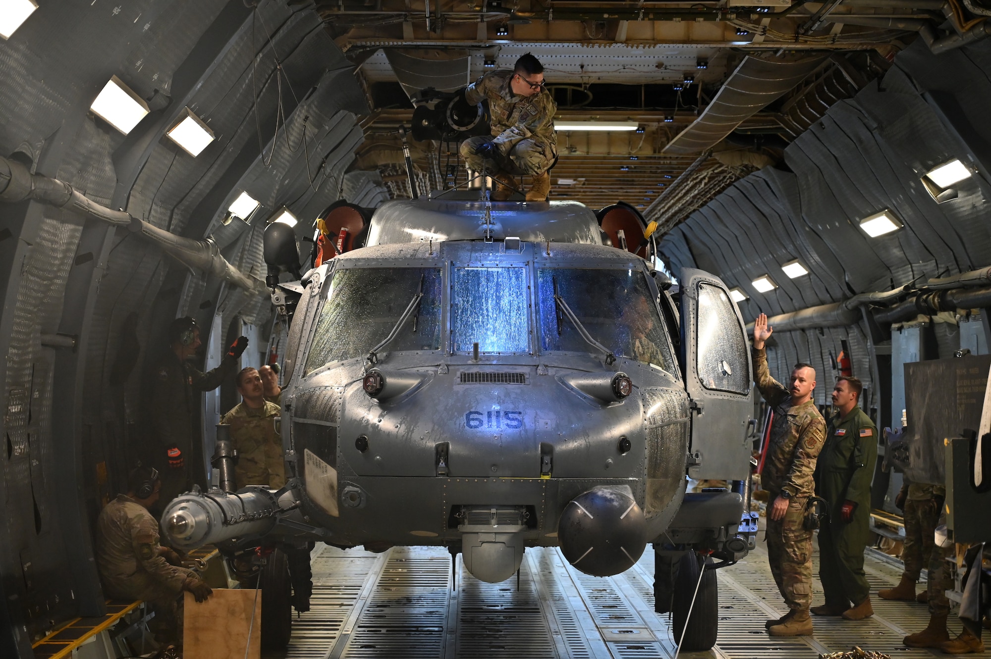 The 68th Airlift Squadron loadmasters onload a HH-60G Pave Hawk from the 920th Rescue Wing onto a C-5M Super Galaxy with help from members of the 920th RW at Patrick Space Force Base, Florida, Jan. 19, 2024.