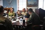 Maj. Gen. Thomas Harrell, director, Defense Health Network Central, Defense Health Agency; director, San Antonio Market; commander, 59th Medical Wing; and the lead for Air Force Medical Agency Alpha, responds to a question about healthcare access for recruiters during a meeting at Joint Base San Antonio-Randolph, Texas, Jan. 11, 2024.