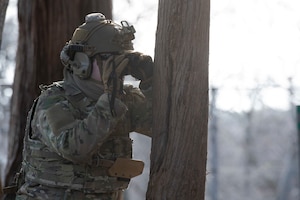 A U.S. Air Force Explosive Ordnance Disposal (EOD) technician examines a training UXO (Unexploded Ordnance) during the HABU exercise at Misawa Air Base, Japan, Jan. 23, 2024.
