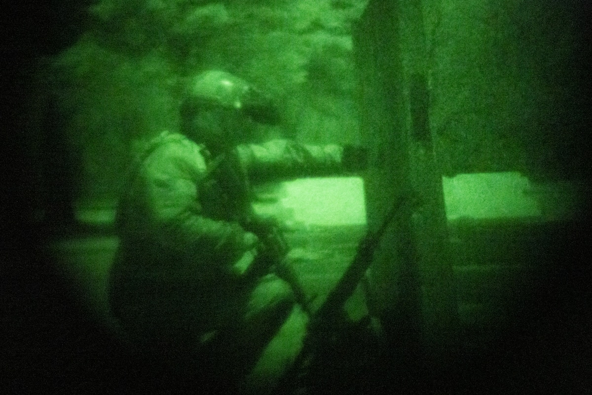A U.S. Air Force Explosive Ordnance Disposal (EOD) technician waits for his team leader behind cover during the HABU exercise at Misawa Air Base, Japan, Jan. 23, 2024.