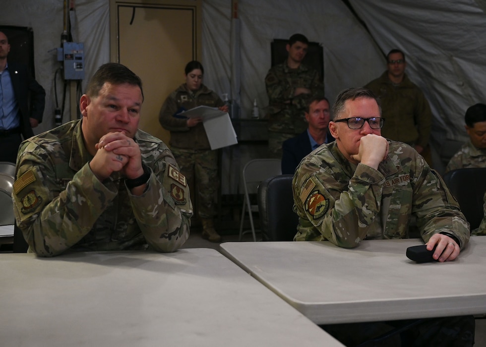 U.S. Air Force Brig. Gen. William Kale, Air Force Civil Engineer Center commander and Chief Master Sgt. Edward Fitzgerald, AFCEC senior enlisted leader, are briefed on the mission of Joint All Domain Exercise Forward Operations Readiness Generation Exercise at Goodfellow Air Force Base, Texas, Jan. 18, 2024. JADE FORGE is a simulated joint deployment area that provides a training environment for intelligence, surveillance and reconnaissance students. (U.S. Air Force photo by Airman 1st Class Evelyn D’Errico)