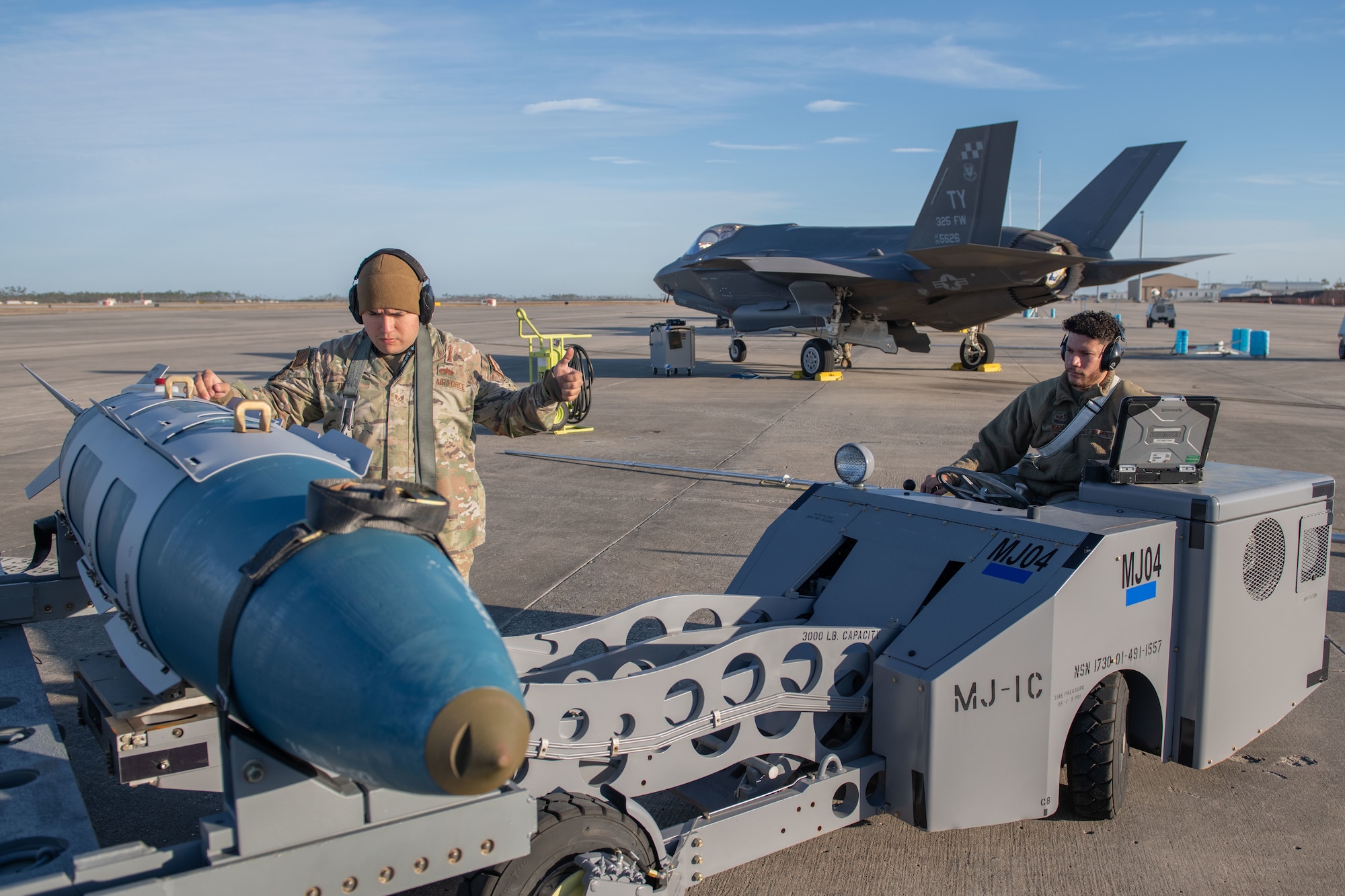 Airmen move munitions