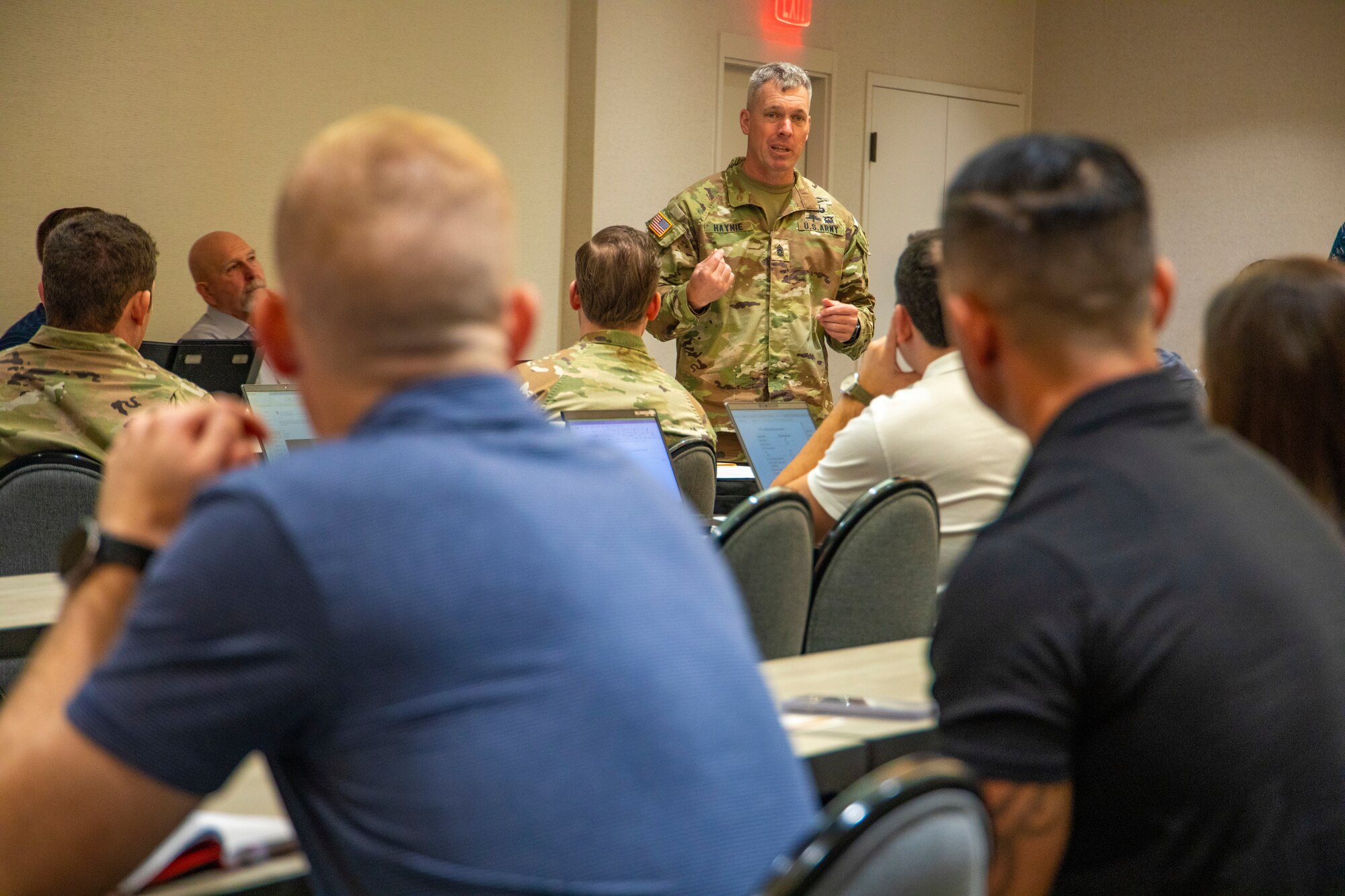 U.S. Army Command Sgt. Maj. Robert Haynie, the 25th Infantry Division and U.S. Army Hawaii command sergeant major, speaks about innovation of military uniforms and equipment during a Jungle Environment Leadership Working Group, Jan. 22, 2024, Honolulu, Hawaii. The working group was held for jungle-affiliated military leaders to speak about establishing a priority list of material modernization efforts and acquisition strategies for Organizational Clothing and Individual Equipment (OCIE) and protection specific to the jungle environment. (U.S. Army photo by Sgt. Alvin Conley, 25th Infantry Division)