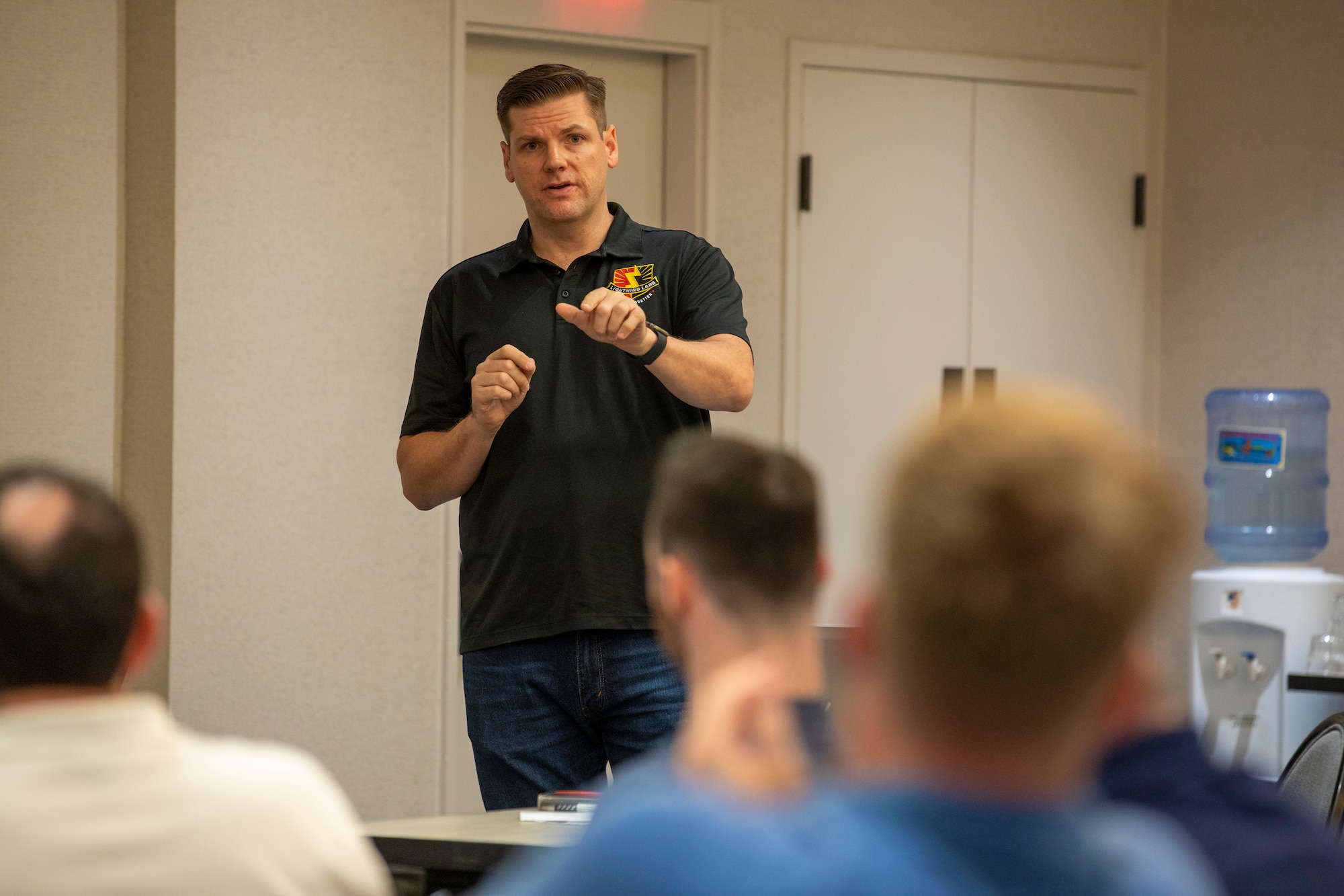 U.S. Army Maj. Jason Hinds, the Lightning Labs Director, 25th Infantry Division, speaks about innovation and modernization of equipment during a Jungle Environment Leadership Working Group, Jan. 22, 2024, Honolulu, Hawaii. The working group was held for jungle-affiliated military leaders to speak about establishing a priority list of material modernization efforts and acquisition strategies for Organizational Clothing and Individual Equipment (OCIE) and protection specific to the jungle environment. (U.S. Army photo by Sgt. Alvin Conley, 25th Infantry Division)