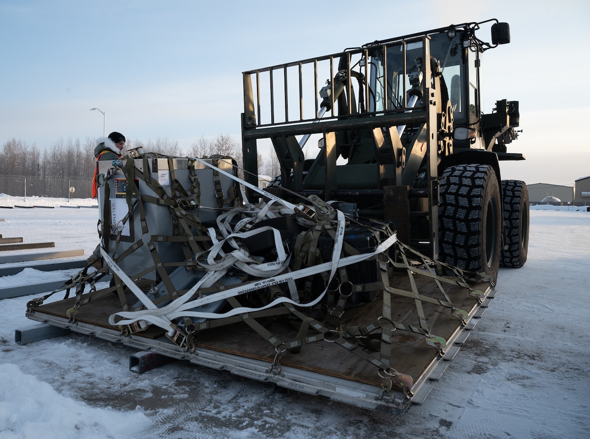 A forklift crew from the 354th Logistics Readiness Squadron unloads a pallet of equipment for exercise Arctic Gold 24-1, on Eielson Air Force Base, Alaska, Jan 24, 2024. Exercise Arctic Gold 24-1 helped prepare airmen for a real-life deployment and hone their skills within their career field. (U.S. Air Force photo by Airman Spencer Hanson)