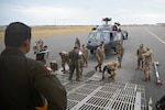 The 68th Airlift Squadron loadmasters prepare to onload a HH-60G Pave Hawk from the 920th Rescue Wing onto a C-5M Super Galaxy with help from members of the 920th RW at Patrick Space Force Base, Florida, Jan. 19, 2024.