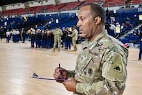 U.S. Army 1st Sgt. Antonio Shaw, District of Columbia National Guard, serves as a head judge for the 2024 JROTC “Best of the Best” Drill Competition at the D.C. Armory, Jan. 27, 2024. The regional qualifier is a collaboration between D.C. Public Schools, D.C. Government Operations, and the D.C. National Guard.