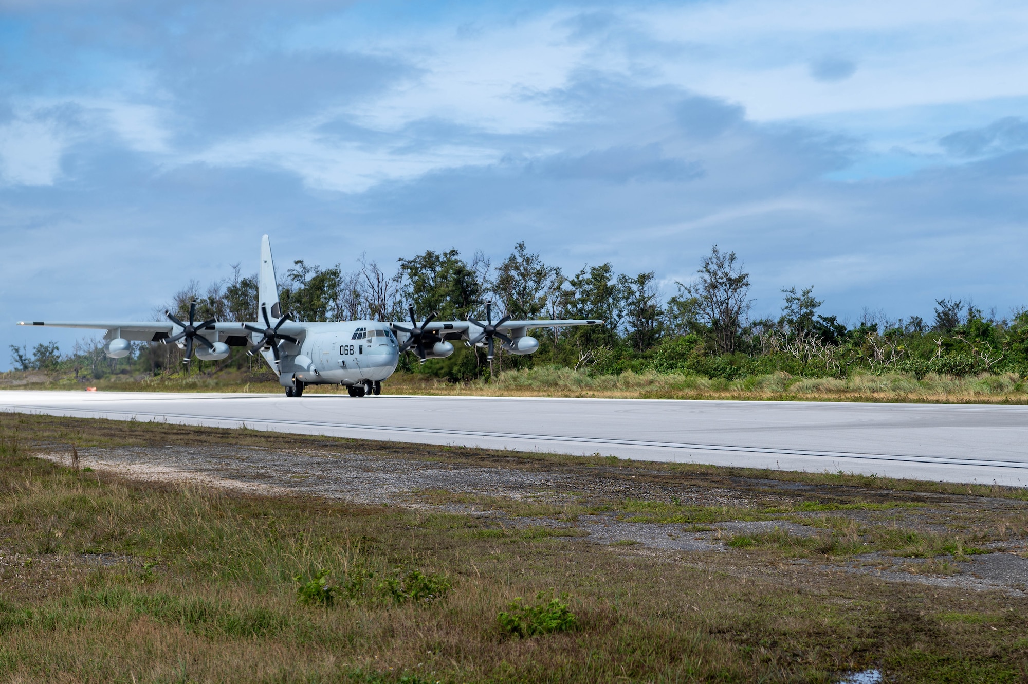 U.S. Marines assigned to the Marine Aerial Refueler Transport Squadron (VMGR) 234, Marine Aircraft Group 41, land a KC-130 on Pacific Regional Training Center - Andersen, Guam, Jan. 23, 2024. The Helicopter Sea Combat Squadron 25, Marine Air Traffic Control Mobile Team and the 36th Contingency Response Squadron participated in a joint training on refueling operations. (U.S. Air Force Photo by Airman 1st Class Allon Lapaix)