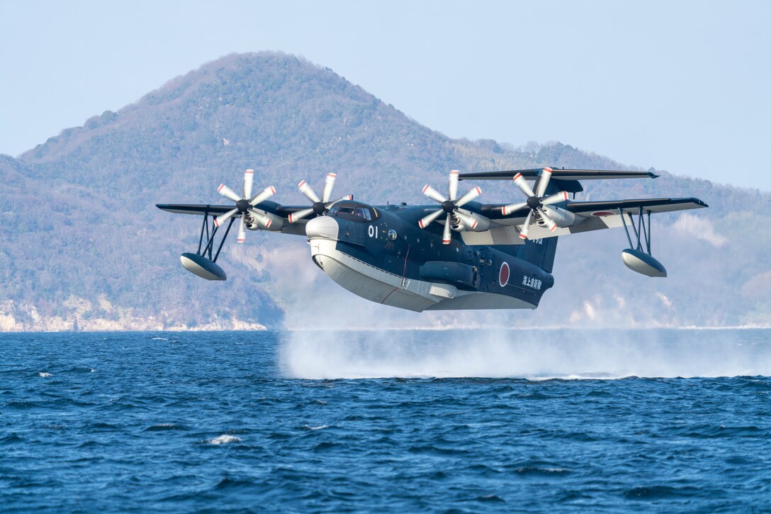 A Japan Maritime Self-Defense Force ShinMaywa US-2 prepares to land on the water during the JMSDF New Year’s flight at Marine Corps Air Station Iwakuni, Japan, January 5, 2023. The JMSDF New Year’s flight is typically held at the beginning of January, and this year’s flight showcased the US-2’s capabilities, as well as Fleet Air Wing 31’s ability to swiftly and successfully conduct search and rescue missions. This is the first time in 9 years the event has been held at Iwakuni. (U.S. Marine Corps photo by Sgt. Mitchell Austin)