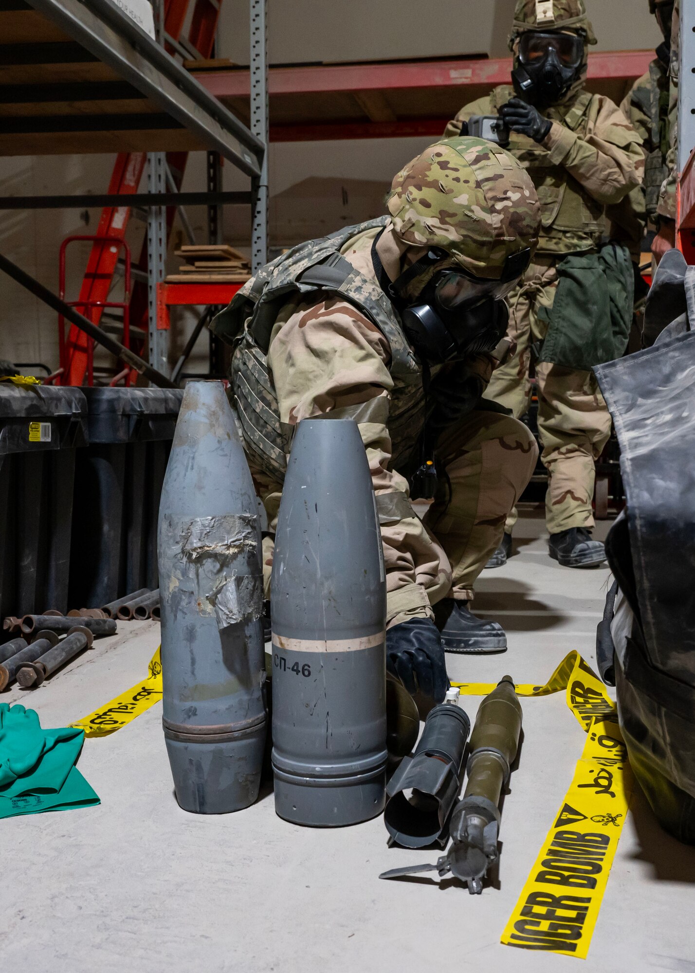 U.S. Air Force Airman 1st Class Jennifer Fusasro, emergency management technician, picks up a vile during exercise Desert Dragon at an undisclosed location in the U.S. Central Command area of responsibility, Jan. 22, 2024. The Desert Dragon exercise is conducted each rotation and ensures that emergency management Airmen are well-prepared to fulfill a pivotal role in readiness, mitigation, response, and recovery from disasters, while also offering CBRN advisement to wing commanders. (U.S. Air Force photo by Senior Airman Sarah Williams)