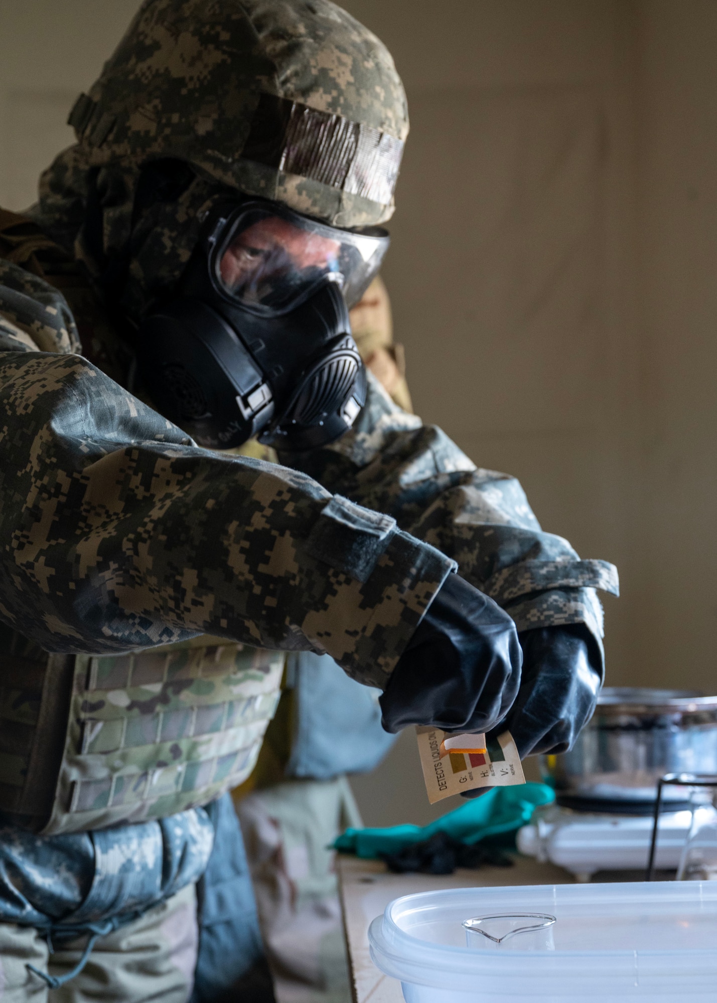 U.S. Air Force Senior Airman Melissa Masseth, emergency management technician, tests a simulated chemical agent at an undisclosed location in the U.S. Central Command area of responsibility, Jan. 22, 2024. During Desert Dragon, Airmen were able to hone traditional CBRN concepts of identifying biological agents and radiation surveys while expanding upon critical thinking skills and expeditionary training. (U.S. Air Force photo by Senior Airman Sarah Williams)