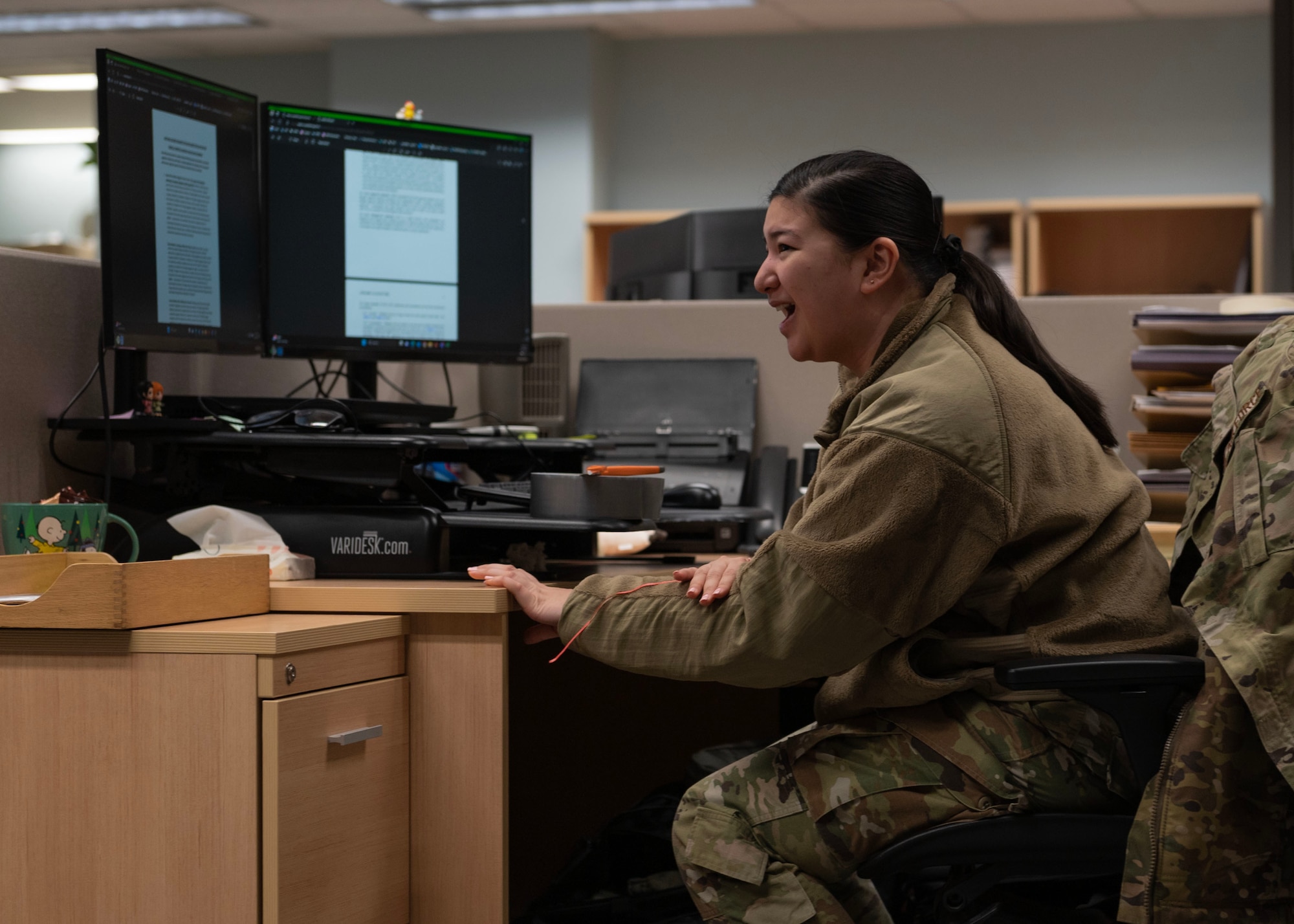 U.S. Air Force Staff Sgt. Angelica Yap, 51st Comptroller Squadron financial operations supervisor, calls out for help, simulating an office injury during Beverly Midnight 24-1, at Osan Air Base, Republic of Korea, Jan. 29, 2024. Airmen were tested during BM24-1 to perform basic life-saving techniques known as TCCC to stabilize trauma patients until medical personnel arrive. BM24-1 is a routine training event that tests the military capabilities across the peninsula, allowing combined and joint training at both the operational and tactical levels. (U.S. Air Force photo by Staff Sgt. Aubree Owens)
