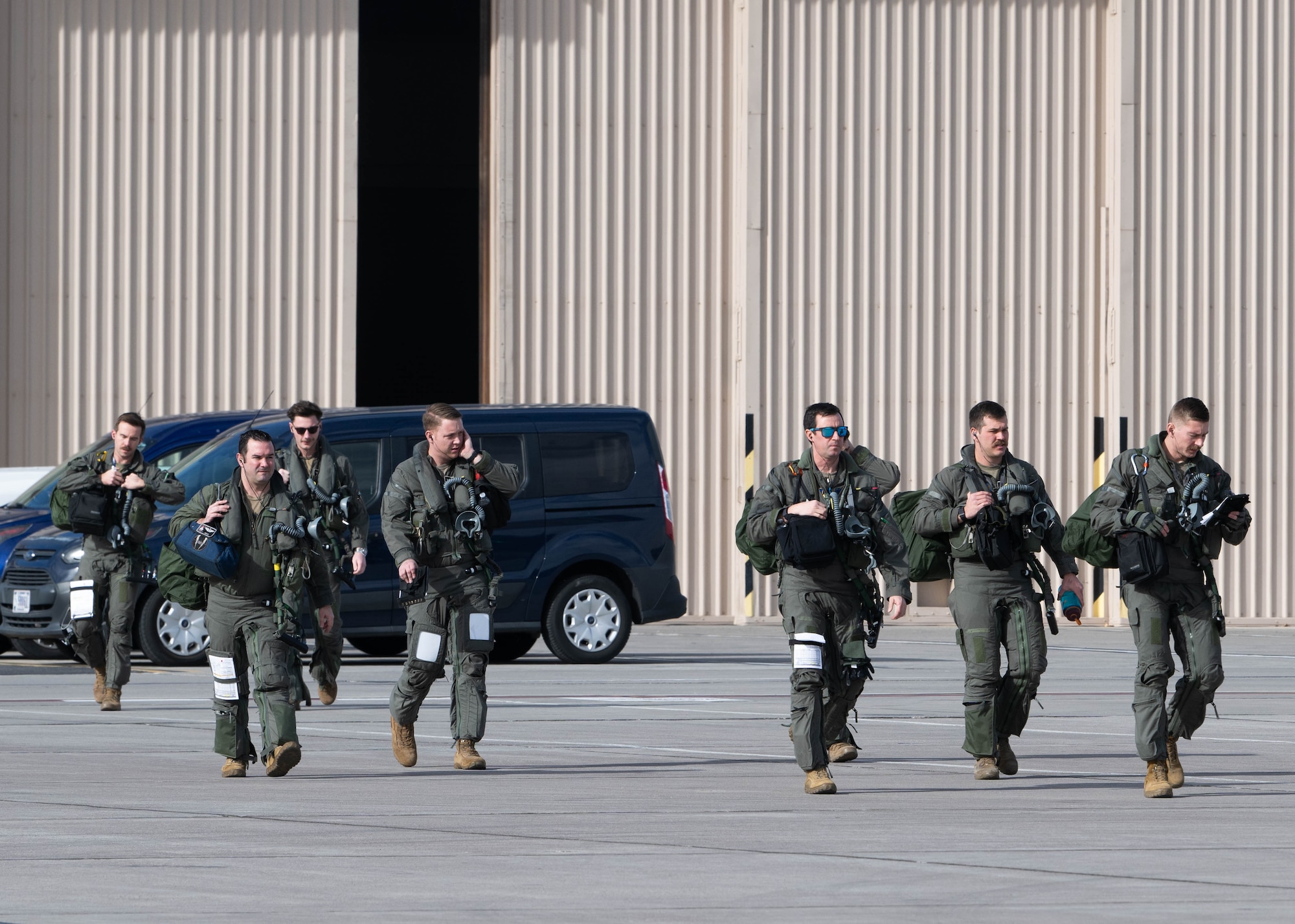 A photo of pilots walking to their aircraft