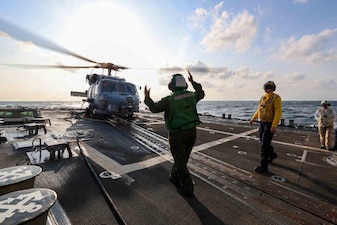 USS John Finn (DDG 113) conducts flight deck operations in the South China Sea.