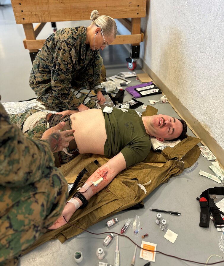U.S. Navy Hospital Corpsman Petty Officer 1st Class Allyson Early, 23D Marine Regiment, 4th Marine Division, Marine Forces Reserve, monitors vital signs of Staff Sgt. Bryan Mullins while he receives a whole blood transfusion for the Valkyrie whole blood transfusion program in San Bruno, CA on Jan. 10, 2024. The Valkyrie Program is a course designed to teach attendees how and when to apply a whole blood transfusion to casualties in a combat environment. (Courtesy Photo)