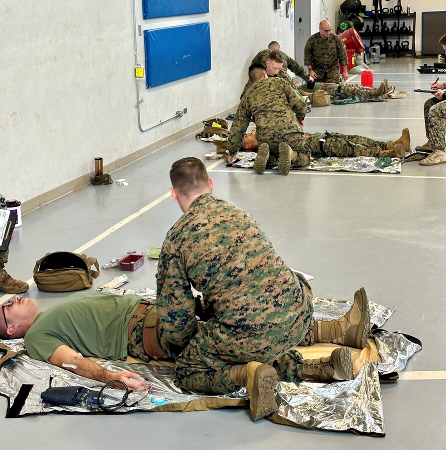 U.S. Navy Hospital Corpsman Petty Officer 2nd Class Jacob Evans, 23D Marine Regiment, 4th Marine Division, Marine Forces Reserve, adjusts a pelvic binder on his patient Sgt. Agustin Michel-Valdez for the Valkyrie whole blood transfusion program in San Bruno, CA on Jan. 10, 2024. The Valkyrie Program is a course designed to teach attendees how and when to apply a whole blood transfusion to casualties in a combat environment. (Courtesy Photo)