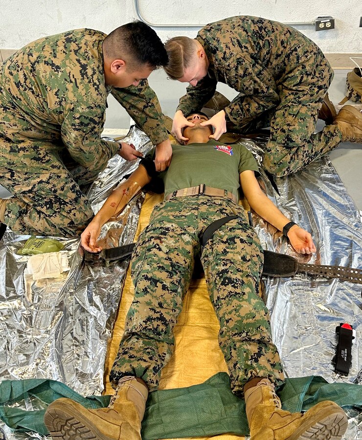 U.S. Navy Hospital Corpsman Alfredo Zuniga, 23D Marine Regiment, 4th Marine Division, Marine Forces Reserve, places a tourniquet after his donor became the patient while Petty Officer 2nd Class Anthony Banas checks Cpl. Eric Carranza Flores’ airway for the Valkyrie whole blood transfusion program in San Bruno, CA on Jan. 10, 2024. The Valkyrie Program is a course designed to teach attendees how and when to apply a whole blood transfusion to casualties in a combat environment. (Courtesy Photo)