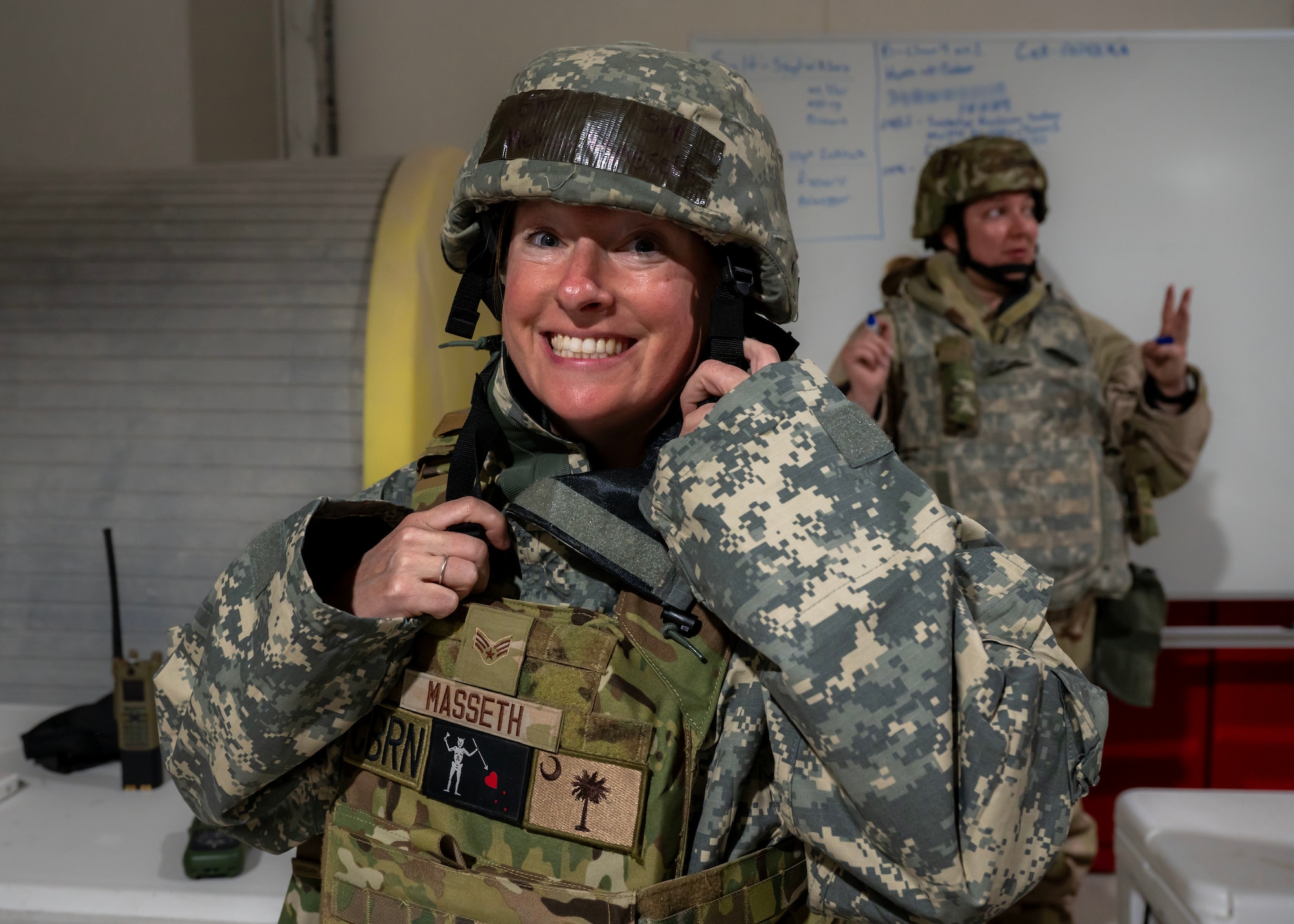 U.S. Air Force Senior Airman Melissa Masseth, emergency management technician, dons MOPP gear during exercise Desert Dragon 2024 at an undisclosed location in the U.S. Central Command area of responsibility, Jan. 22, 2024. U.S. Air Force Airmen from the 332nd, 378th, 379th, 380th, and 386th Air Expeditionary Wings joined together to strengthen chemical, biological, radiological, and nuclear response capabilities. (U.S. Air Force photo by Senior Airman Sarah Williams)