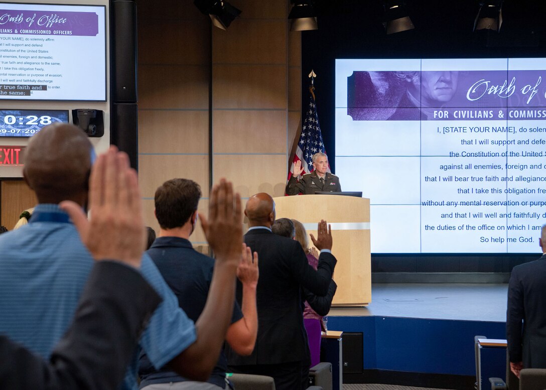 General Nakasone administers the oath of office to new hires.