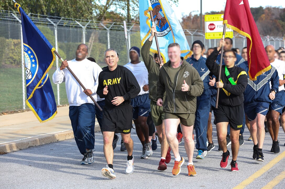 General Nakasone leads a command run in honor of Veterans Day.(Photo by USCYBERCOM Public Affairs Office)