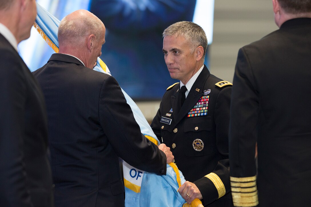 General Nakasone takes Command of CYBERCOM and NSA in May 2018. (Photo by USCYBERCOM Public Affairs Office)