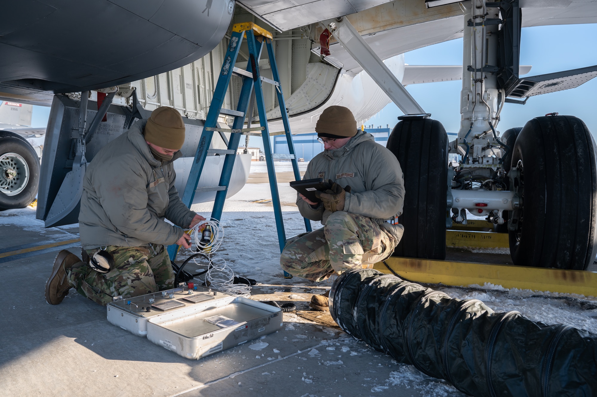 Tech. Sgt. Adrian Bryant, 434th Aircraft Maintenance Squadron aircraft electrical and environmental technician, left, and Staff Sgt. Michael Pascual, 434th Aircraft Maintenance Squadron aircraft electrical and environmental apprentice, set up a control box to test the anti-skid system of a KC-135R Stratotanker.