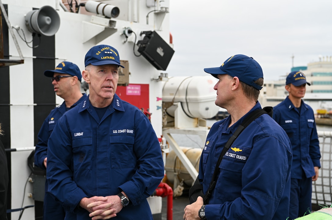 Vice Adm. Kevin Lunday, Commander of Coast Guard Atlantic Area, speaks with the commanding officer of the Coast Guard Cutter Resolute, Lt. Cmdr. Michael Ross, Jan. 29, 2024, in St. Petersburg, FL. Lunday and Ross discussed the events of the patrols and resulting drug interdictions. (U.S. Coast Guard photo by Petty Officer 3rd Class Nicholas Strasburg)