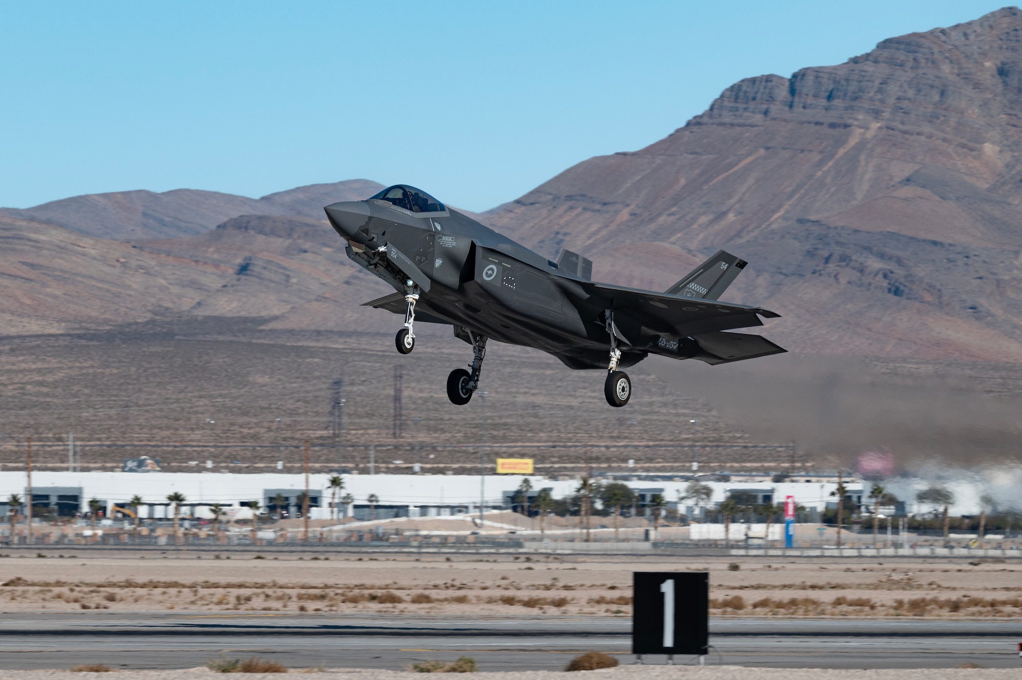 A Royal Australian Air Force F-35A lands at Nellis Air Force Base, Nevada, Jan. 10, 2024 in preparation for Red Flag-Nellis 24-1. This Red Flag will have approximately 30 units and close to 2,000 participants from U.S. and Allied forces. The RAAF is one of the partners Airmen from McConnell Air Force Base, Kansas, will work with during Exercise Bamboo Eagle at Nellis from Jan. 26 to Feb. 2. (U.S. Air Force photo by William R. Lewis)