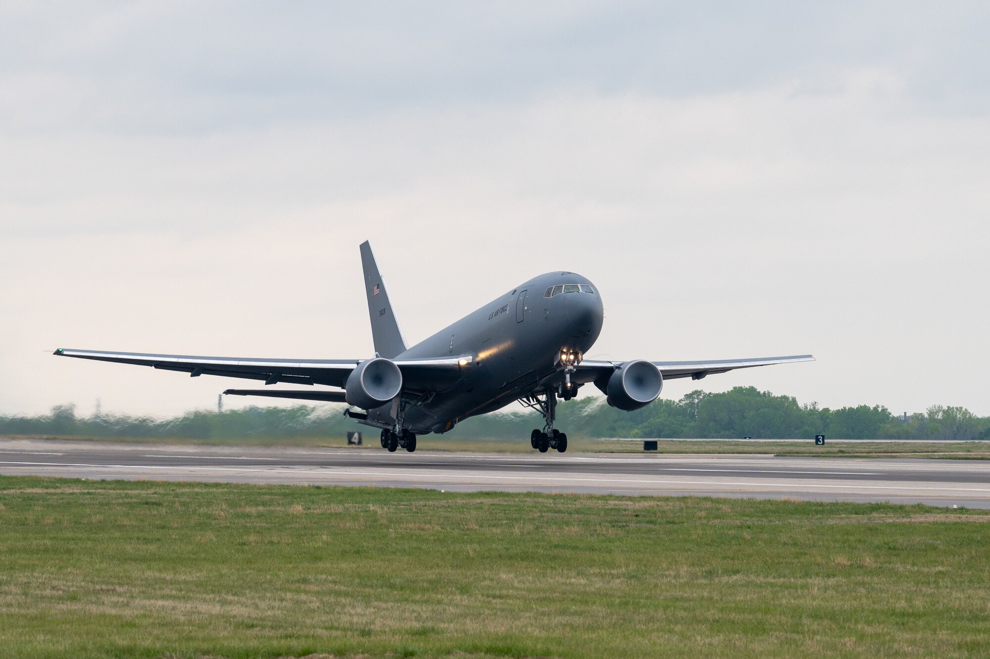 A KC-46A Pegasus takes off April 27, 2023, at McConnell Air Force Base, Kansas. The KC-46 participated in a 5-tanker formation to enhance interoperability. (U.S. Air Force photo by Airman 1st Class Brenden Beezley)