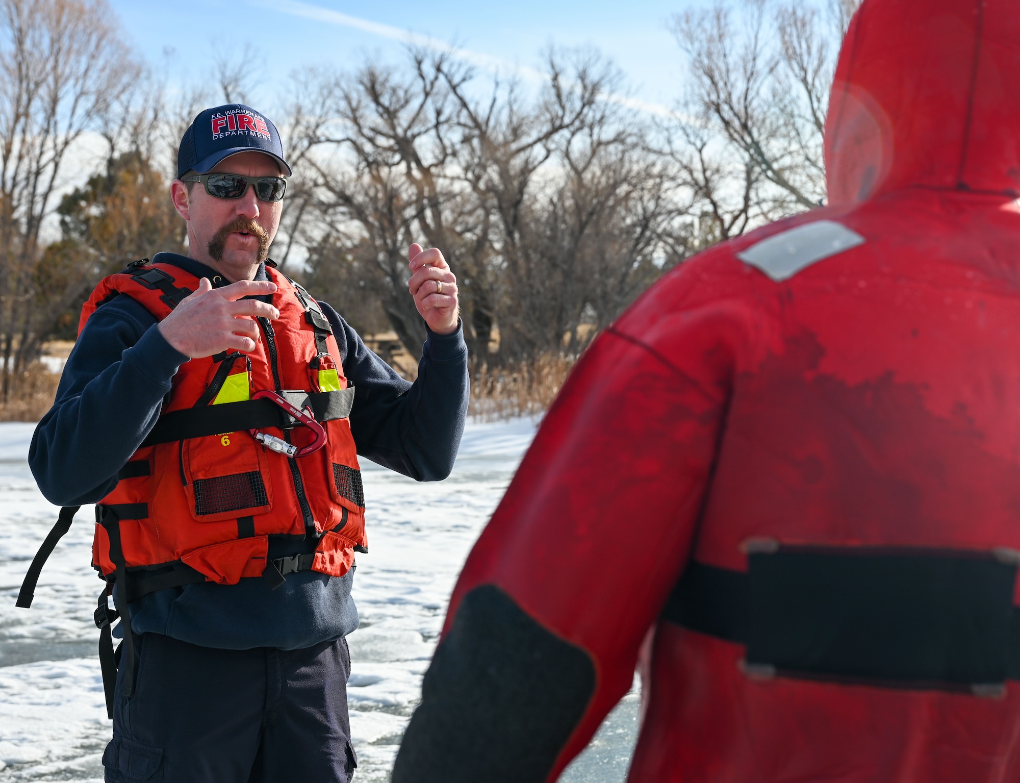 Firefighters participate in ice rescue training.