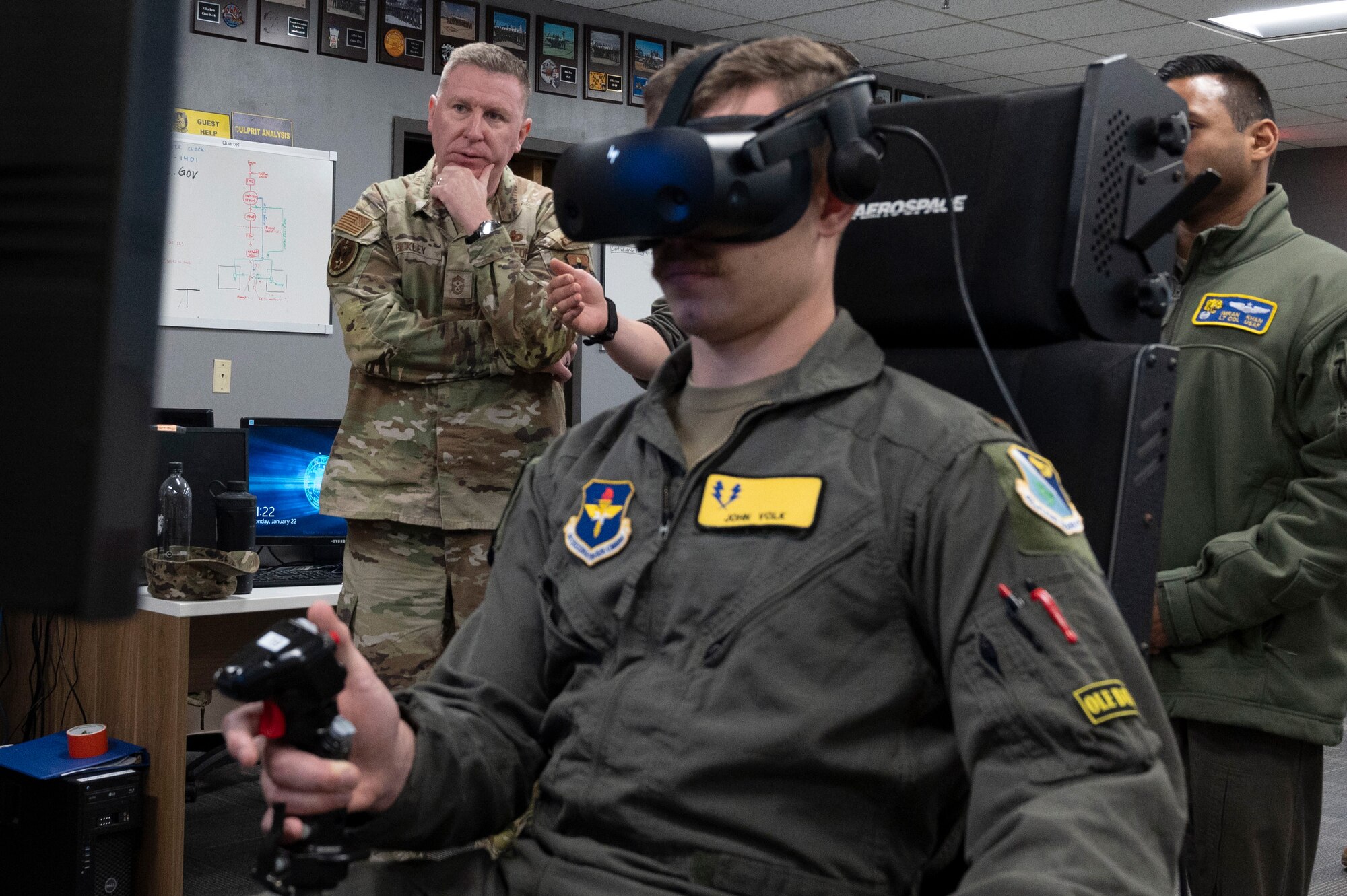 U.S. Air Force Chief Master Sgt. Chad Bickley (left), command chief for Air Education and Training Command, watches as 2nd Lt. John Volk, 47th Student Squadron student pilot, flies a T-6 aircraft simulator inside a 47th Student Squadron classroom at Laughlin Air Force Base, Texas, Jan. 22, 2024. Bickley spent time with Team XL members to get a first-hand glimpse at how Laughlin’s Airmen train student pilots to be the Air Force’s newest and most lethal pilots. (U.S. Air Force photo by Senior Airman Kailee Reynolds)