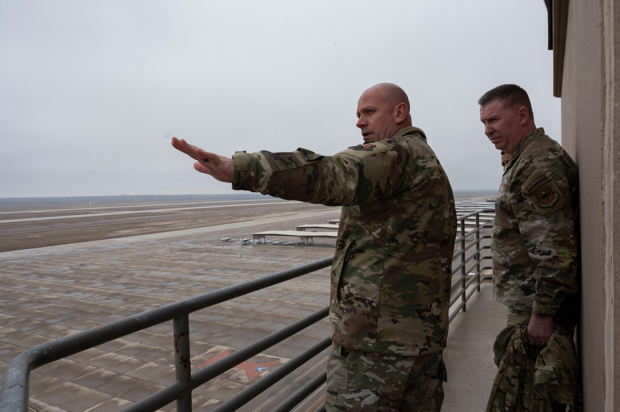 U.S. Air Force Col. Kevin Davidson (left), 47th Flying Training Wing commander, shows Chief Master Sgt. Chad Bickley (right), command chief for Air Education and Training Command, the aircraft and sunshades on the flight line at Laughlin Air Force Base, Texas, Jan. 22, 2024. Bickley visited Laughlin to meet the people producing combat-ready Airmen, leaders and pilots. (U.S. Air Force photo by Senior Airman Kailee Reynolds)