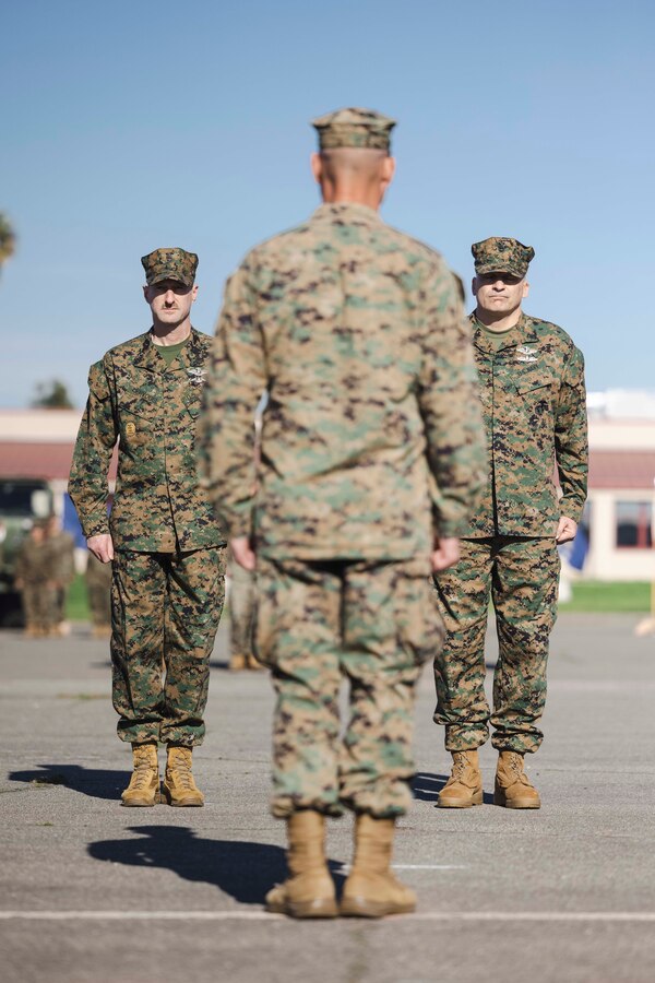 U.S. Navy Master Chief Charles F. Ziervogel, left, outgoing command master chief for I Marine Expeditionary Force and U.S. Navy Master Chief Loren D. Rucker, right, oncoming command master chief for I MEF, report to U.S. Marine Corps Maj. Gen. Bradford J. Gering, middle, commanding general of I MEF, during a change of charge ceremony at Marine Corps Base Camp Pendleton, California, Jan. 26, 2024. Ziervogel, relinquished his duties as the I MEF Command Master Chief to Rucker. (U.S. Marine Corps photo by Sgt. Samuel C. Fletcher)