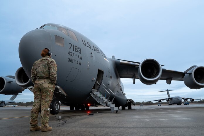 A photo of Airmen performing preflight checks.