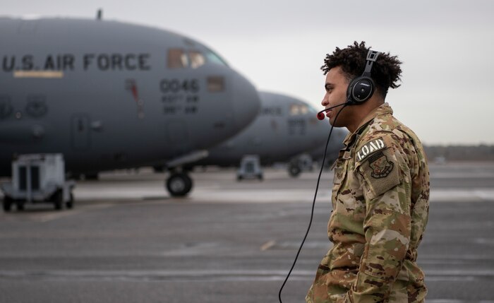 A photo of an Airman performing preflight checks.